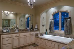 A bathroom with a large window and a bathtub.