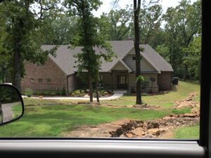 A view of a house from a car window.