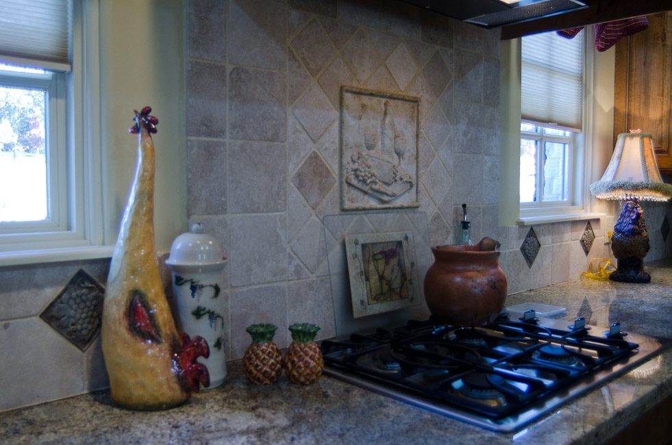 A kitchen with a stove and a window.