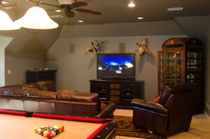 A pool table in a living room.