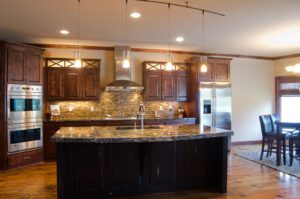 A kitchen with hardwood floors and a center island.