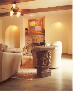 A living room with couches and a fireplace.